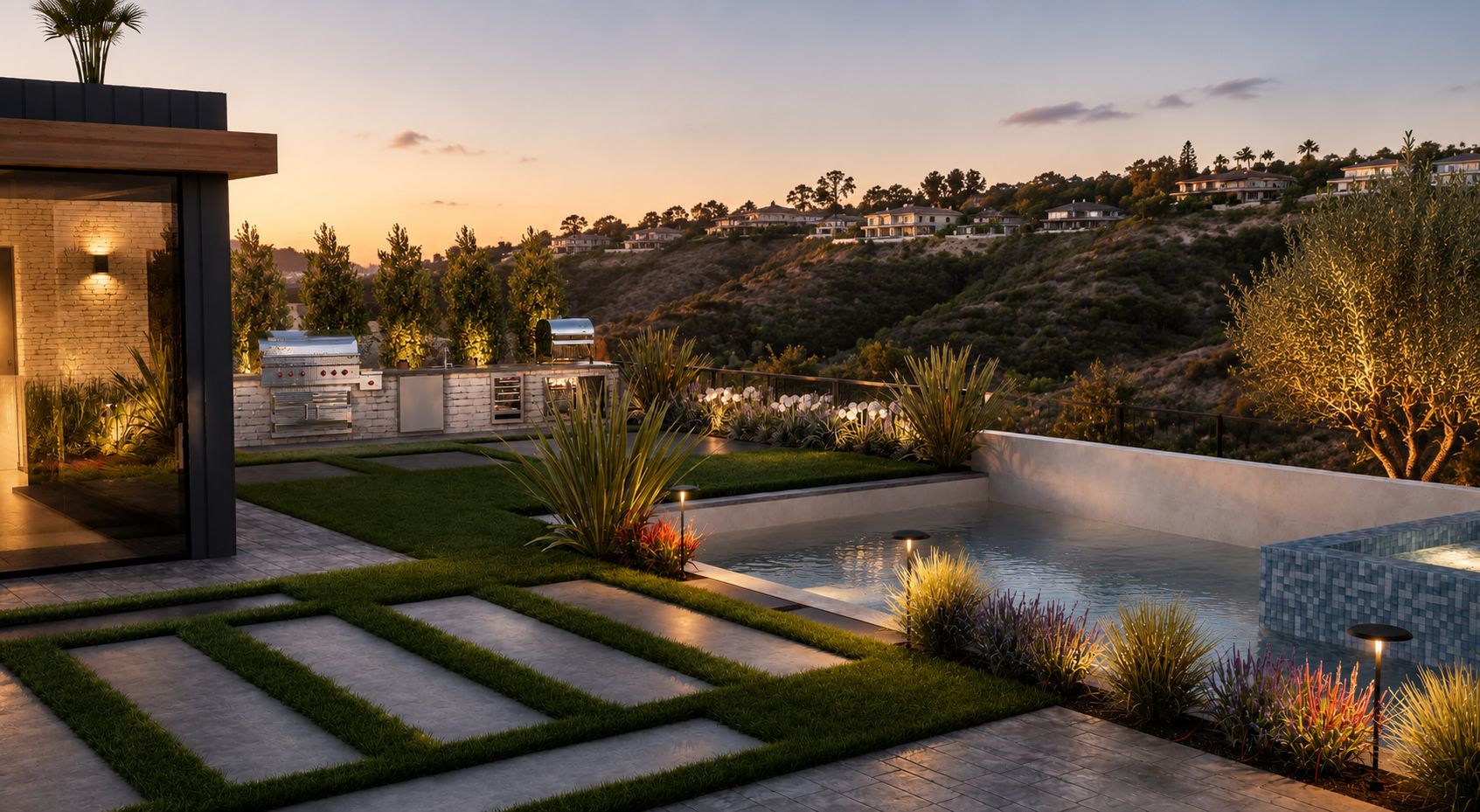 Outdoor kitchen, lawn, pool, and spa at a contemporary Newport Beach estate overlooking the surrounding hillside.